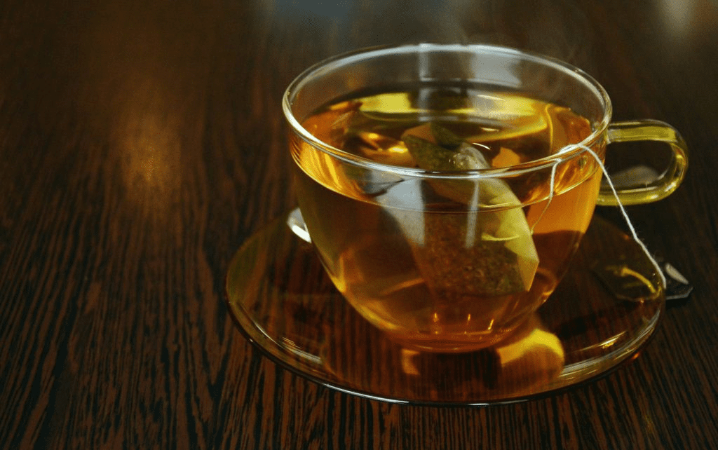 Clear cup of tea with a tea bag