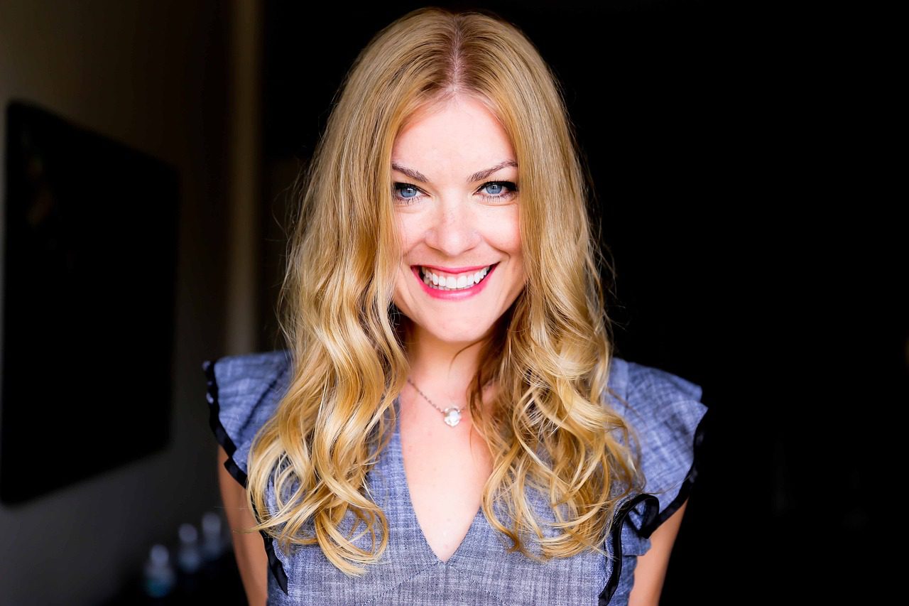 smiling woman with blue blouse